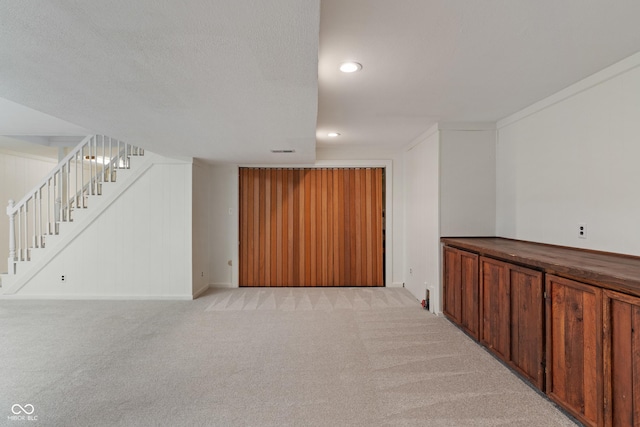 10184 Lakeshore Dr E, Carmel, IN 46033 - finished basement featuring light colored carpet, stairs, and recessed lighting