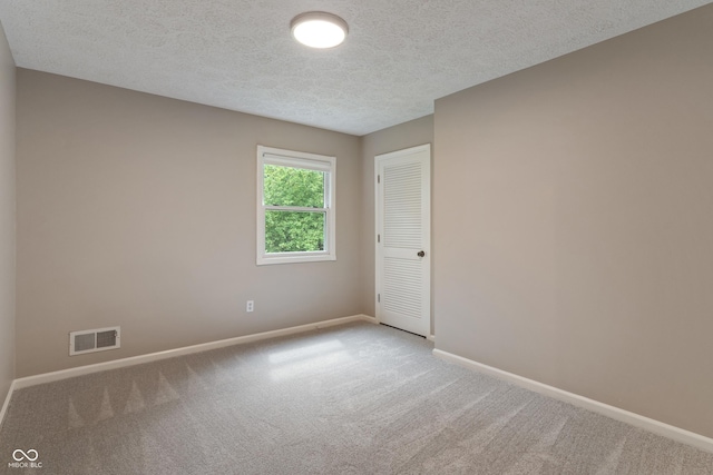 10184 Lakeshore Dr E, Carmel, IN 46033 - unfurnished room with carpet and a textured ceiling