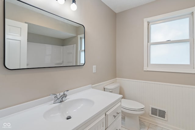 10184 Lakeshore Dr E, Carmel, IN 46033 - bathroom featuring a wainscoted wall, vanity, and a shower