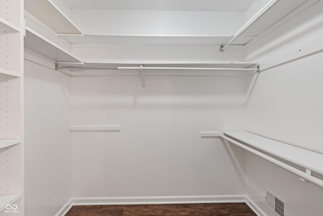 10184 Lakeshore Dr E, Carmel, IN 46033 - walk in closet featuring dark wood finished floors