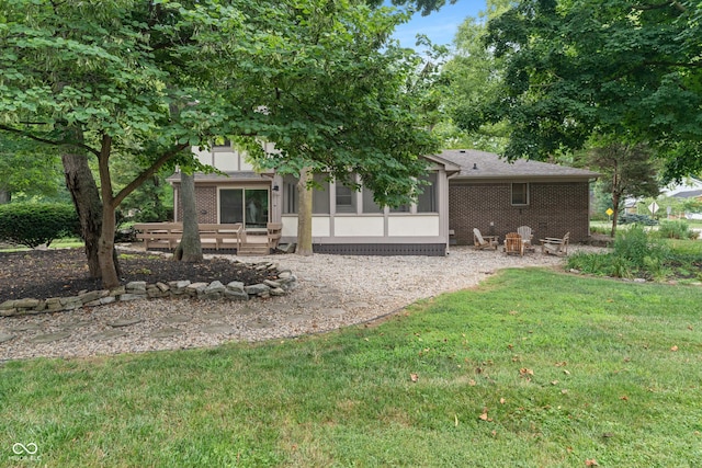 10184 Lakeshore Dr E, Carmel, IN 46033 - back of property featuring a yard and brick siding