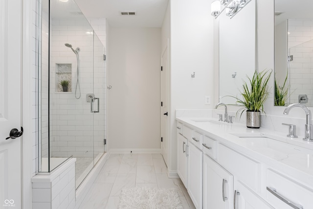2570 Congress St, Carmel, IN 46032 - bathroom with a shower stall, double vanity, and marble finish floors