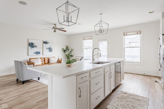 2570 Congress St, Carmel, IN 46032 - kitchen featuring light wood-type flooring, plenty of natural light, and light countertops