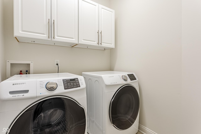 2570 Congress St, Carmel, IN 46032 - washroom with cabinet space and washer and clothes dryer