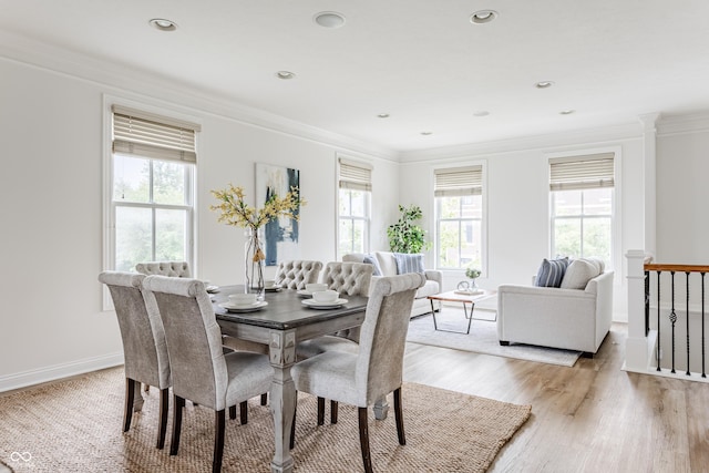 2570 Congress St, Carmel, IN 46032 - dining area with light wood-style flooring, ornamental molding, and recessed lighting