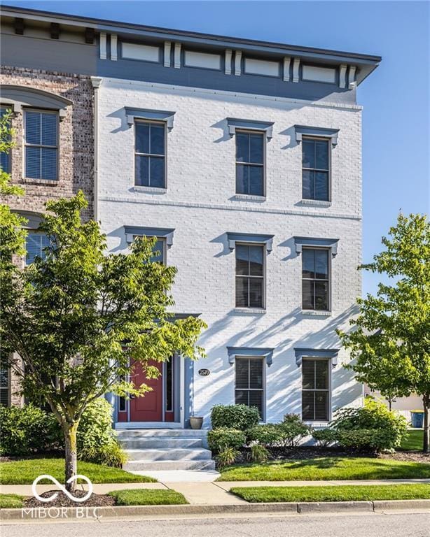 2570 Congress St, Carmel, IN 46032 - italianate home featuring brick siding