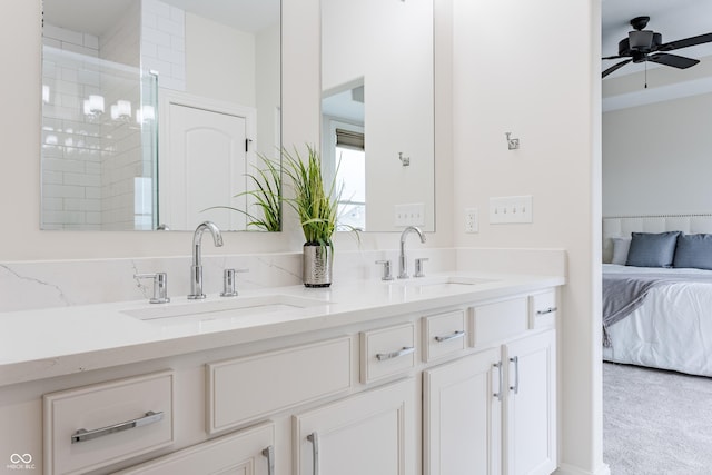 2570 Congress St, Carmel, IN 46032 - bathroom with double vanity, ceiling fan, connected bathroom, and a tile shower
