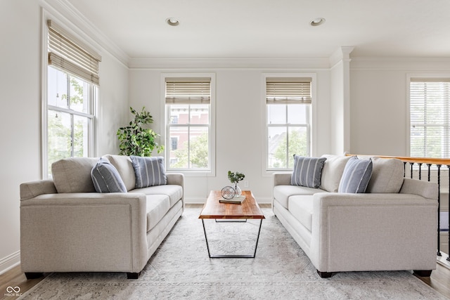 2570 Congress St, Carmel, IN 46032 - living area with crown molding, plenty of natural light, wood finished floors, and recessed lighting