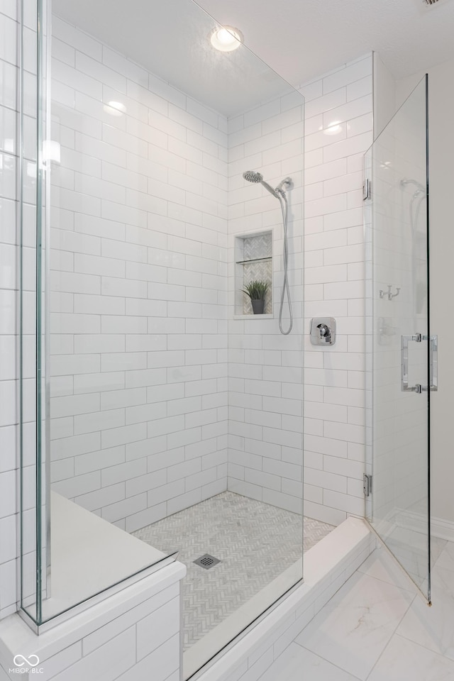 2570 Congress St, Carmel, IN 46032 - full bathroom featuring a shower stall and marble finish floors