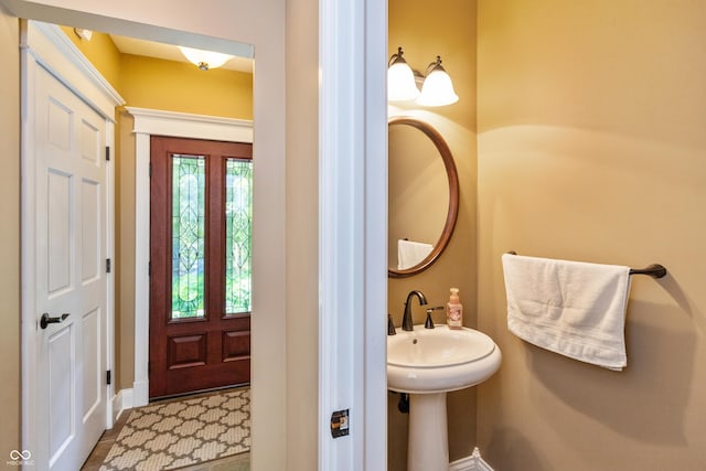 3750 S Whitehorse Rd, Nashville, IN 47448 - bathroom with baseboards and a sink