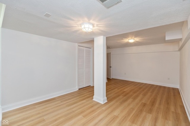 3750 S Whitehorse Rd, Nashville, IN 47448 - finished below grade area with light wood-type flooring and a textured ceiling