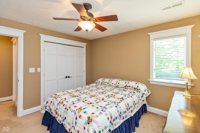 3750 S Whitehorse Rd, Nashville, IN 47448 - bedroom featuring light colored carpet, a closet, and ceiling fan
