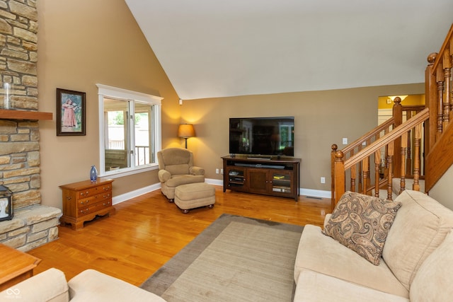 3750 S Whitehorse Rd, Nashville, IN 47448 - living area with wood finished floors, stairway, and high vaulted ceiling