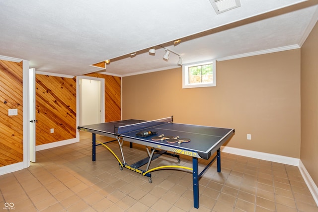 3750 S Whitehorse Rd, Nashville, IN 47448 - recreation room featuring ornamental molding, light tile patterned flooring, and wooden walls