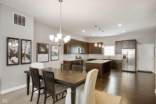 869 N Park Trail Dr, Carmel, IN 46032 - dining space featuring a chandelier, wood finished floors, and recessed lighting