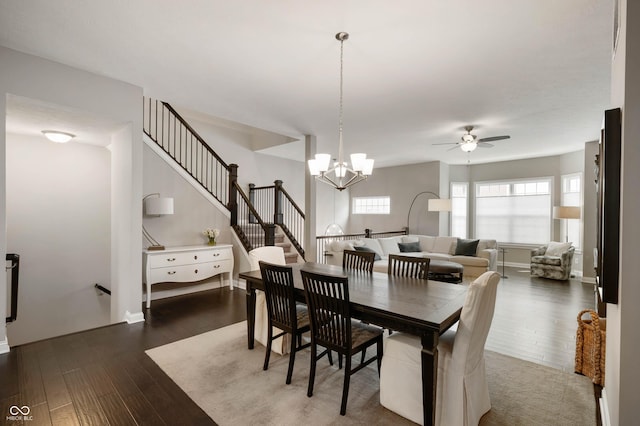 869 N Park Trail Dr, Carmel, IN 46032 - dining room with dark wood-style flooring, ceiling fan, a chandelier, and stairway