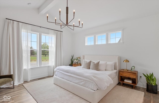 1275 Stonehaven Dr, Westfield, IN 46074 - bedroom featuring wood finished floors and a chandelier