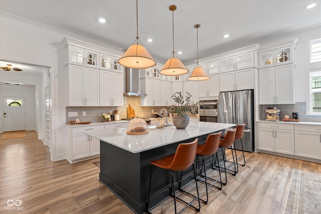 1275 Stonehaven Dr, Westfield, IN 46074 - kitchen featuring stainless steel appliances, backsplash, light countertops, recessed lighting, and a kitchen island with sink
