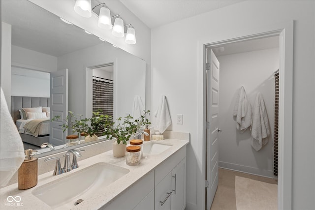 1275 Stonehaven Dr, Westfield, IN 46074 - ensuite bathroom featuring double vanity, a closet, and a heating unit