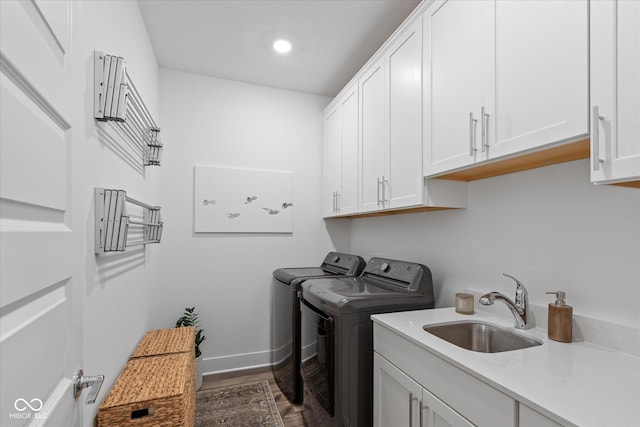 1275 Stonehaven Dr, Westfield, IN 46074 - washroom featuring cabinet space, separate washer and dryer, dark wood-type flooring, and recessed lighting