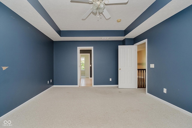13722 Wendessa Dr, Fishers, IN 46038 - unfurnished bedroom with a raised ceiling, carpet, and ceiling fan