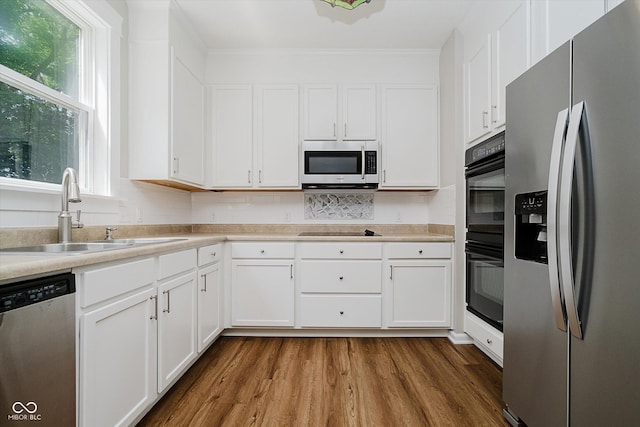 13722 Wendessa Dr, Fishers, IN 46038 - kitchen featuring black appliances, white cabinetry, dark wood-type flooring, light countertops, and crown molding