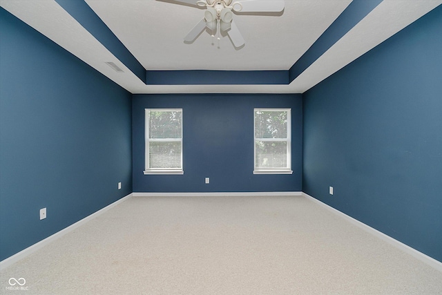 13722 Wendessa Dr, Fishers, IN 46038 - empty room with a tray ceiling, carpet floors, and a ceiling fan