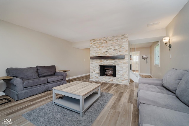 20 Druid Hill Ct, Carmel, IN 46032 - living area featuring light wood finished floors and a fireplace