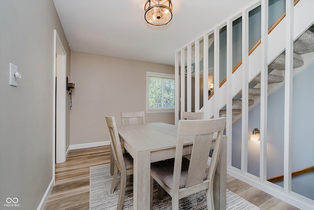 20 Druid Hill Ct, Carmel, IN 46032 - dining room featuring light wood-style floors and stairway