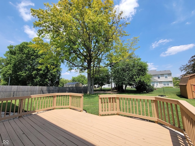 1047 S Jefferson St, Brownsburg, IN 46112 - wooden terrace with a fenced backyard and a storage unit