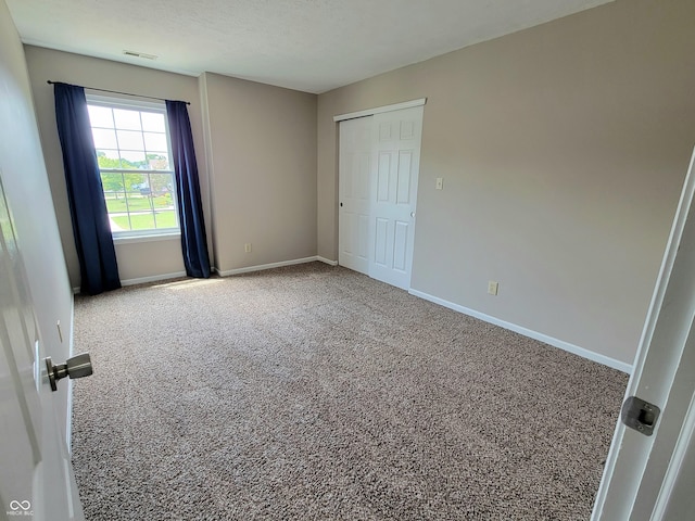 1047 S Jefferson St, Brownsburg, IN 46112 - spare room featuring baseboards and carpet floors