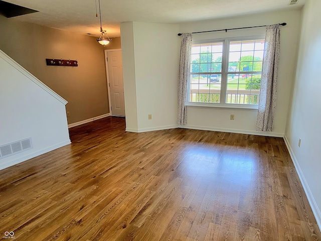 1047 S Jefferson St, Brownsburg, IN 46112 - unfurnished room with wood-type flooring and baseboards