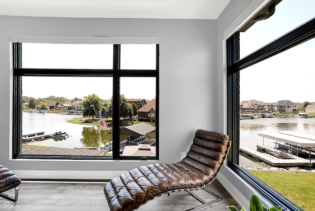 13417 Cambridge Cove Way, Fishers, IN 46055 - living area featuring a water view, wood finished floors, and a residential view