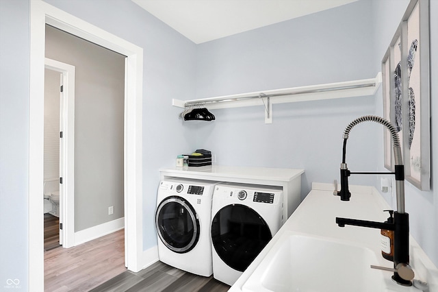 13417 Cambridge Cove Way, Fishers, IN 46055 - laundry room with washer and clothes dryer and wood finished floors
