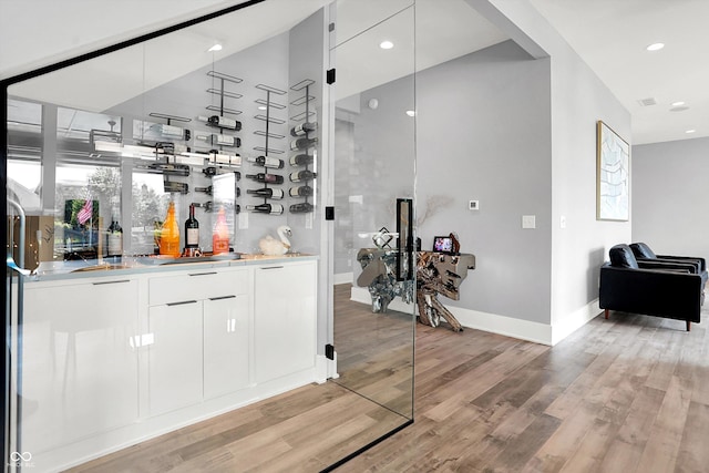 13417 Cambridge Cove Way, Fishers, IN 46055 - indoor bar featuring light wood-style floors and recessed lighting