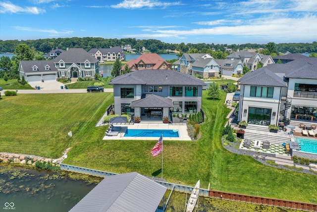 13417 Cambridge Cove Way, Fishers, IN 46055 - back of house with a balcony, a residential view, a patio, and a water view