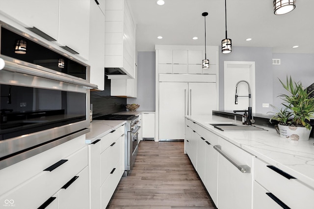 13417 Cambridge Cove Way, Fishers, IN 46055 - kitchen featuring modern cabinets, high end appliances, recessed lighting, and white cabinetry