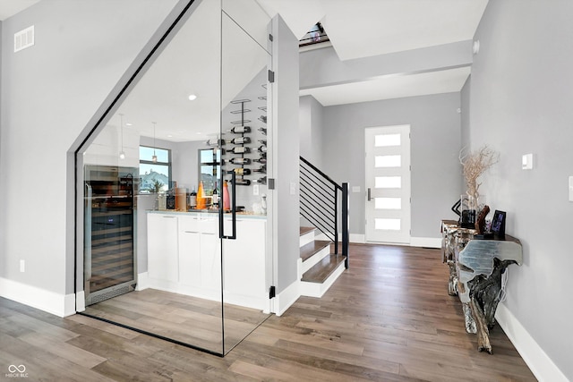 13417 Cambridge Cove Way, Fishers, IN 46055 - wine room featuring wine cooler and light wood-type flooring