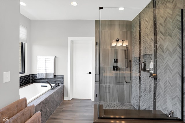 13417 Cambridge Cove Way, Fishers, IN 46055 - bathroom with a garden tub, a stall shower, and recessed lighting