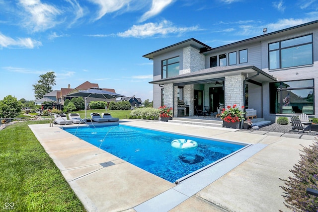 13417 Cambridge Cove Way, Fishers, IN 46055 - swimming pool featuring a patio area and a lawn