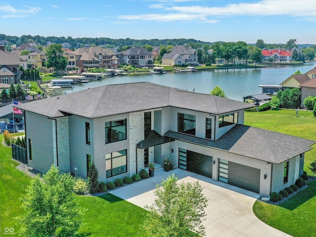 13417 Cambridge Cove Way, Fishers, IN 46055 - view of front of property featuring a shingled roof, a residential view, concrete driveway, a water view, and a front lawn