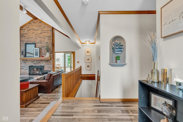 11534 Capistrano Cir, Indianapolis, IN 46236 - corridor featuring wood finished floors, ornamental molding, and lofted ceiling