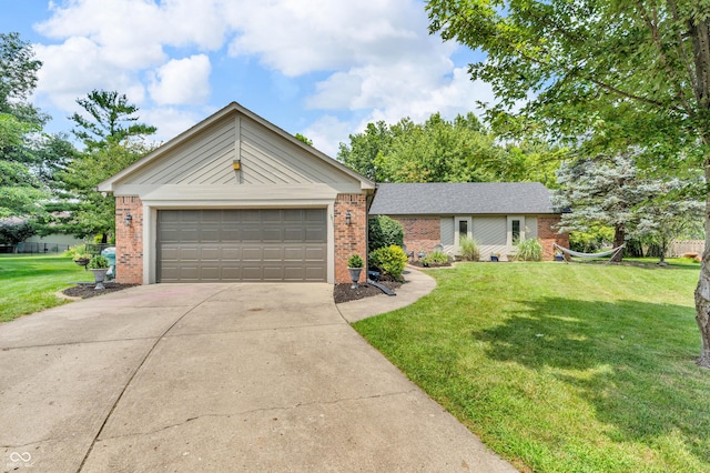 11534 Capistrano Cir, Indianapolis, IN 46236 - view of front of home featuring brick siding, a front yard, and driveway