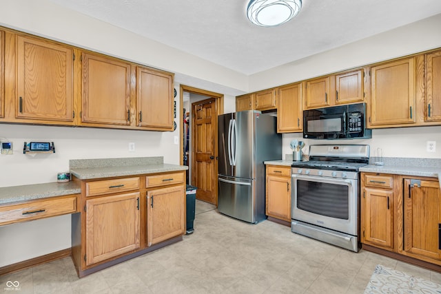 11534 Capistrano Cir, Indianapolis, IN 46236 - kitchen with stainless steel appliances, light countertops, and brown cabinetry
