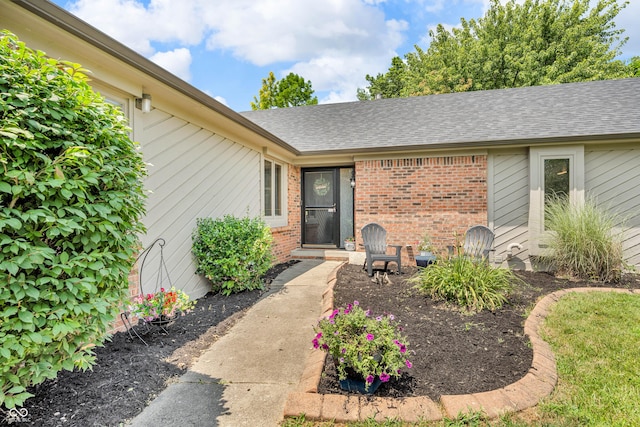 11534 Capistrano Cir, Indianapolis, IN 46236 - property entrance with brick siding and roof with shingles