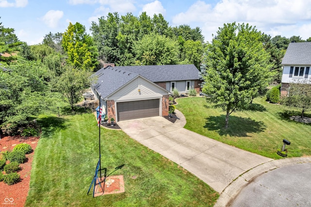 11534 Capistrano Cir, Indianapolis, IN 46236 - view of front facade with brick siding, driveway, a garage, and a front yard