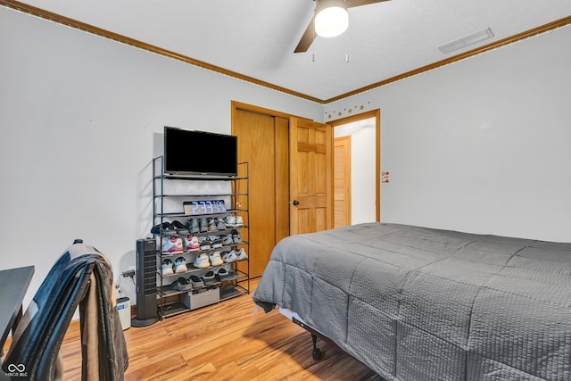 11534 Capistrano Cir, Indianapolis, IN 46236 - bedroom with light wood-type flooring, crown molding, and ceiling fan