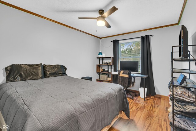 11534 Capistrano Cir, Indianapolis, IN 46236 - bedroom featuring crown molding, light wood-style flooring, and a ceiling fan