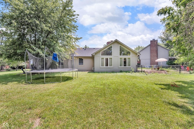 11534 Capistrano Cir, Indianapolis, IN 46236 - rear view of house with a trampoline