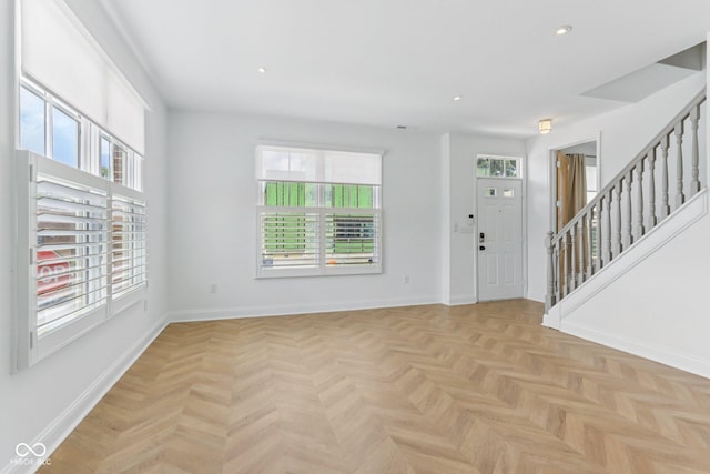 1003 Alabama St, Indianapolis, IN 46202 - entrance foyer with healthy amount of natural light, stairs, and recessed lighting